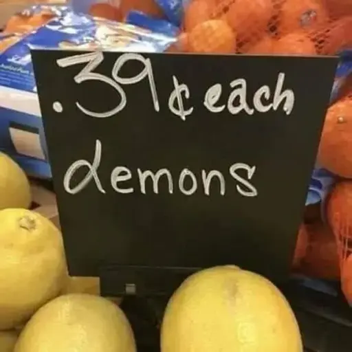 Price sign on a bunch of lemons reading ".39¢ each lemons", however the l looks like a d, so it says "demons"